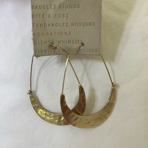 By Anthropologie - Medium sized gold hammered hoop earrings.